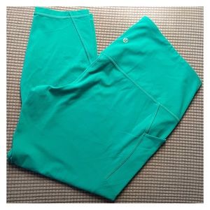 Lululemon leggings- size 14. Side pockets and band pocket. Small tear but sewn.